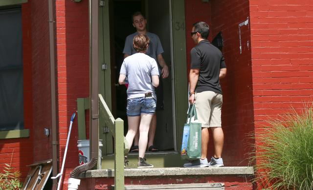 Staff welcoming students back to off-campus